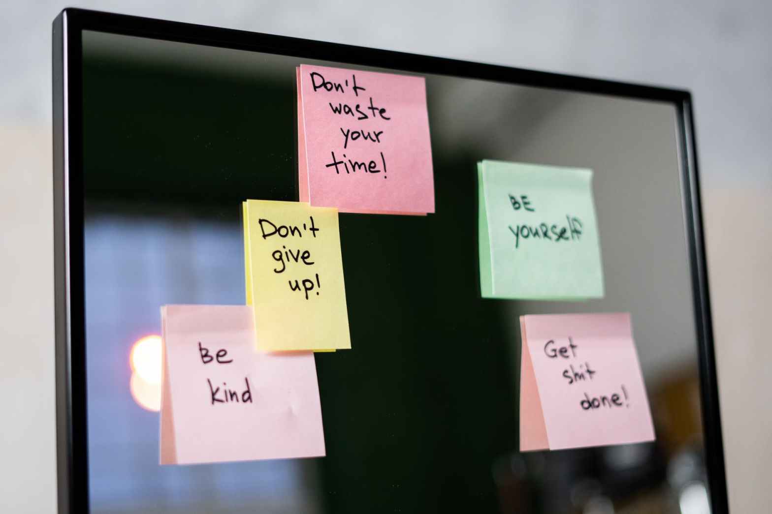 sticky notes on glass wall